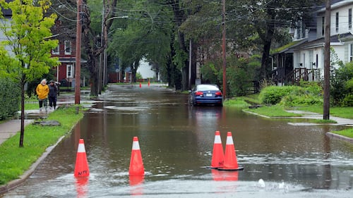 A flooded road is pictured.
