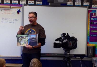 Galen reads to students during Read In Week. (Credit: Galen McDougall)