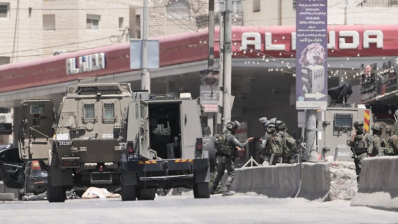 Israel's military said a Palestinian family could bury their father. Then the settlers arrived