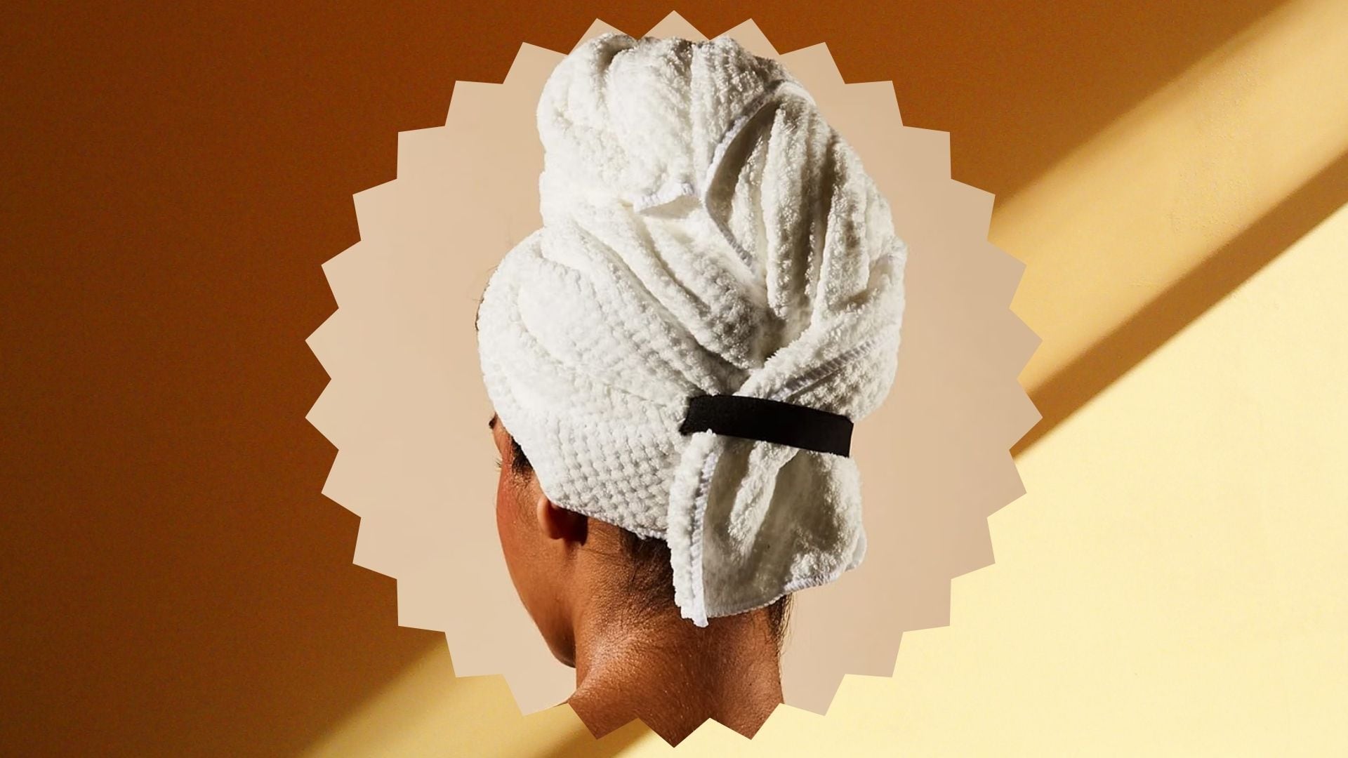 A person wearing an Everist Hair Towel on their head.