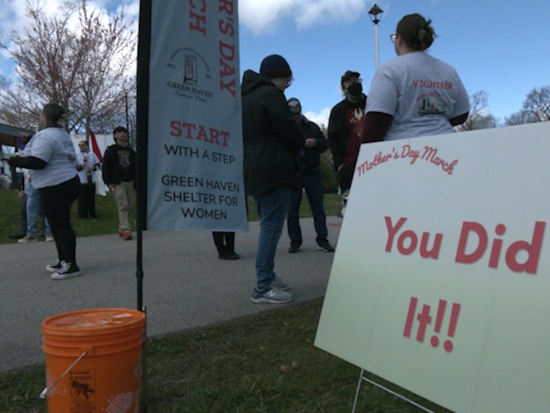 Families walk in Mother’s Day March raising awareness of violence against women