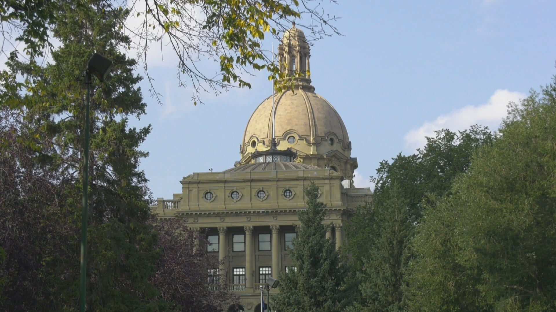 Alberta delaying new restrictions on flags in schools, national anthem mandate