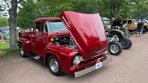 A classic red truck is pictured.