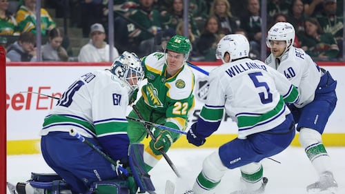 Canucks lose 5-2 as Wild wrap up a playoff spot