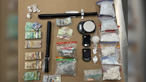 2 Cochrane, Alta., residents charged after seizure of drugs, cash and weapons: RCMP