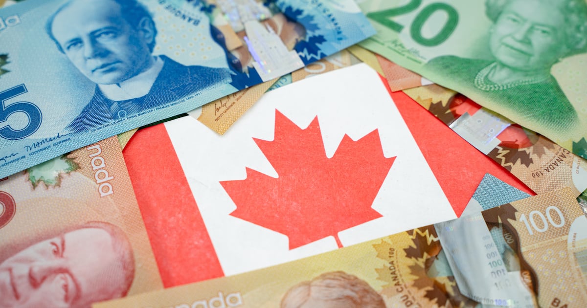 A Canadian flag on dollar banknotes. (Getty Images)