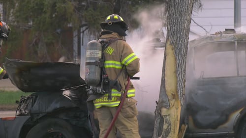 Firefighters put out a vehicle fire on eastbound 107 Avenue near Mayfield Road in Edmonton the morning of May 15, 2026. (Evan Klippenstein / CTV News Edmonton)