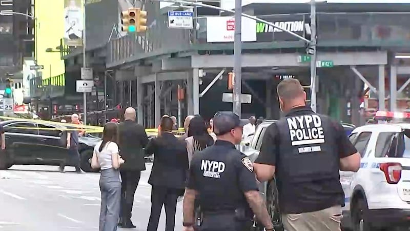 A woman brandishing two knives is shot by police in Times Square