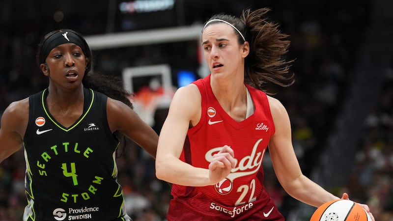 Caitlin Clark’s triple-double sends high-scoring Fever past Fire