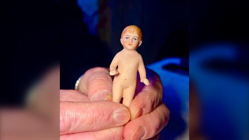 A small doll is pictured.