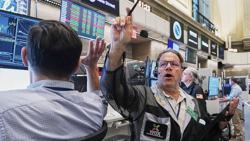Wall Street retreats from its record as stocks fall worldwide