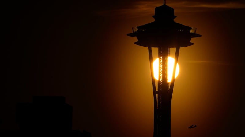 Seattle police are searching for two men who parachuted from the Space Needle
