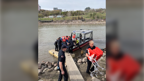 Passengers on the Edmonton Riverboat are helped to shore by Edmonton Fire Rescue Services during a Mother's Day cruise on May 10, 2026. (Source: Christa Jones)