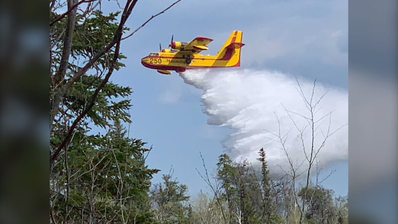 Water bombers, helicopters, sprinklers all being used to fight pair of Manitoba wildfires