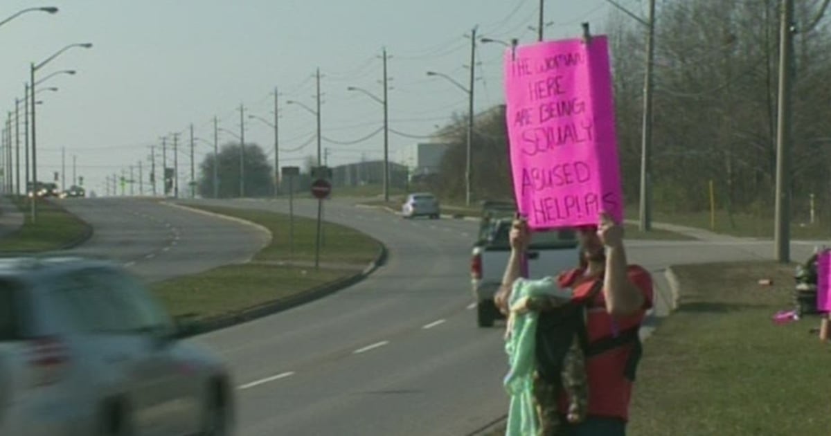 A protest continues outside the gates of a Kitchener prison