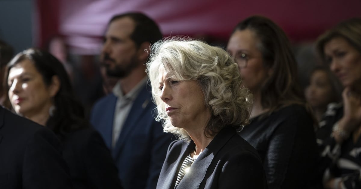 The head of the new federal government Major Projects Office Dawn Farrell listens as Prime Minister Mark Carney announces five major projects in Edmonton on Thursday, Sept. 11, 2025. THE CANADIAN PRESS/Amber Bracken