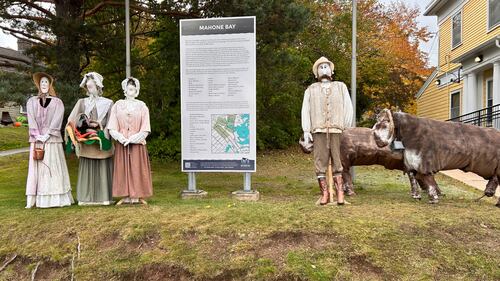 Scarecrows are pictured.