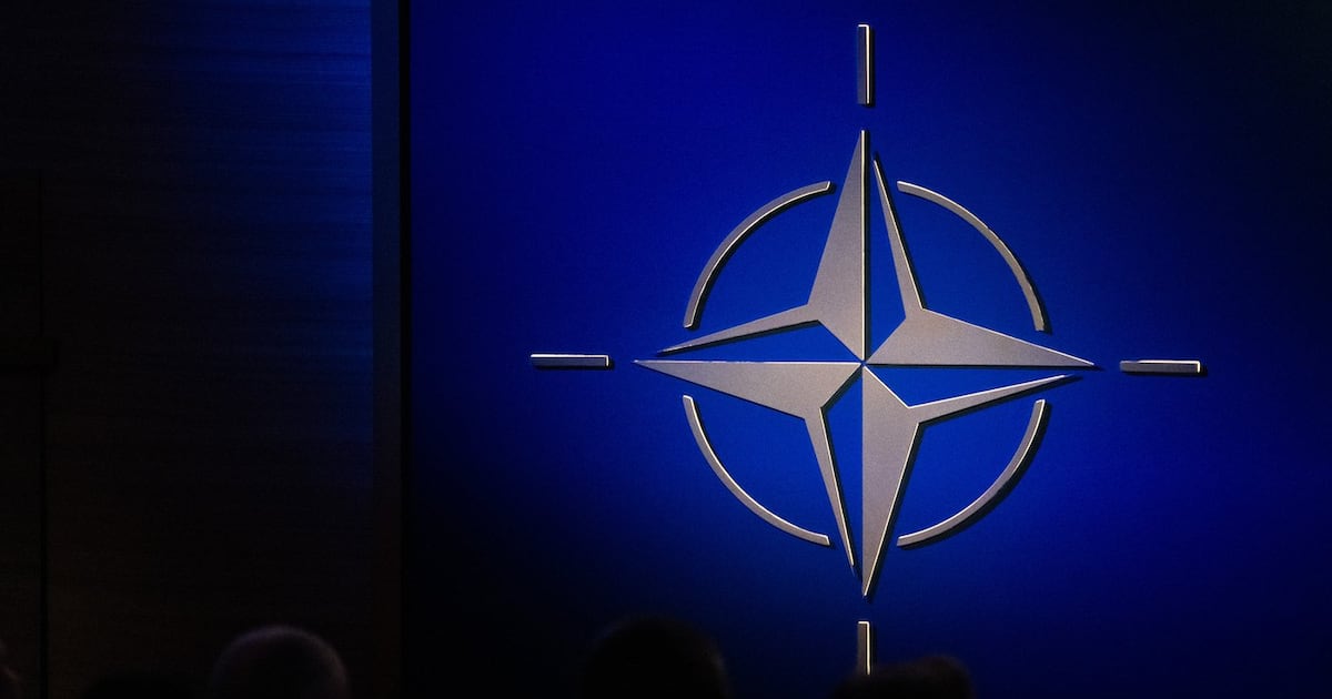 The NATO logo is illuminated beside the stage during a ceremony celebrating the alliance's 75th anniversary in Washington on Tuesday, July 9, 2024. THE CANADIAN PRESS/Adrian Wyld