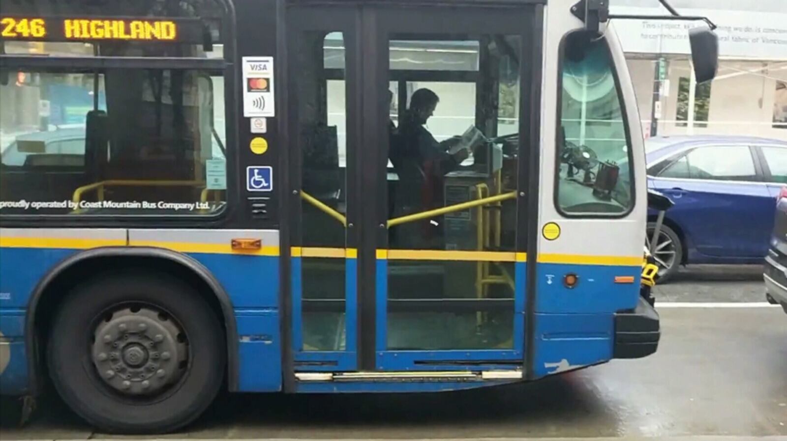 Video shows TransLink bus driver reading behind the wheel
