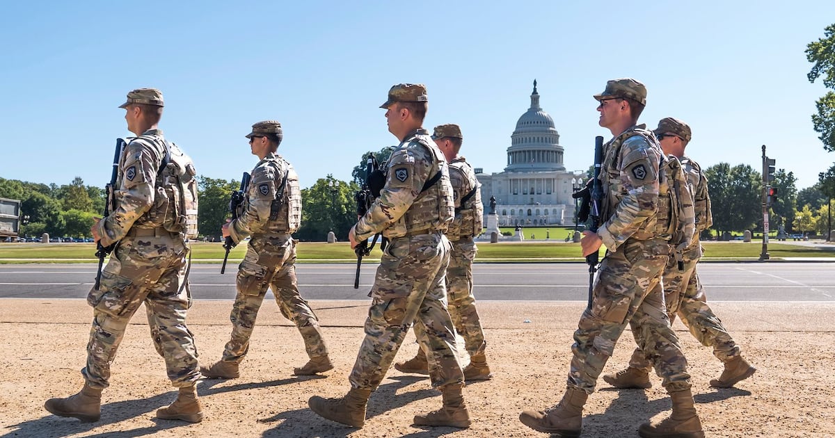 Armed National Guard soldiers from West Virginia patrol the Mall near the Capitol in Washington, as part of President Donald Trump's order to impose federal law enforcement in the nation's capital, Aug. 26, 2025. (AP Photo/J. Scott Applewhite, File)
