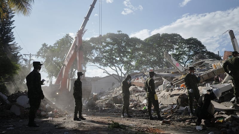 Rescuers call for silence around earthquake rubble as window for survival narrows in Colombia