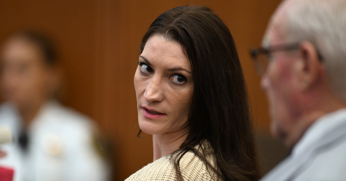 Photo: ctvnews.ca Lindsay Clancy, center, speaks with her lawyer Kevin Reddington during proceedings in her murder trial, Thursday, Aug. 20