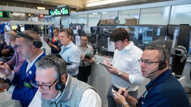 U.S. stocks edge back from their record following the first big batch of profit reports for the summer