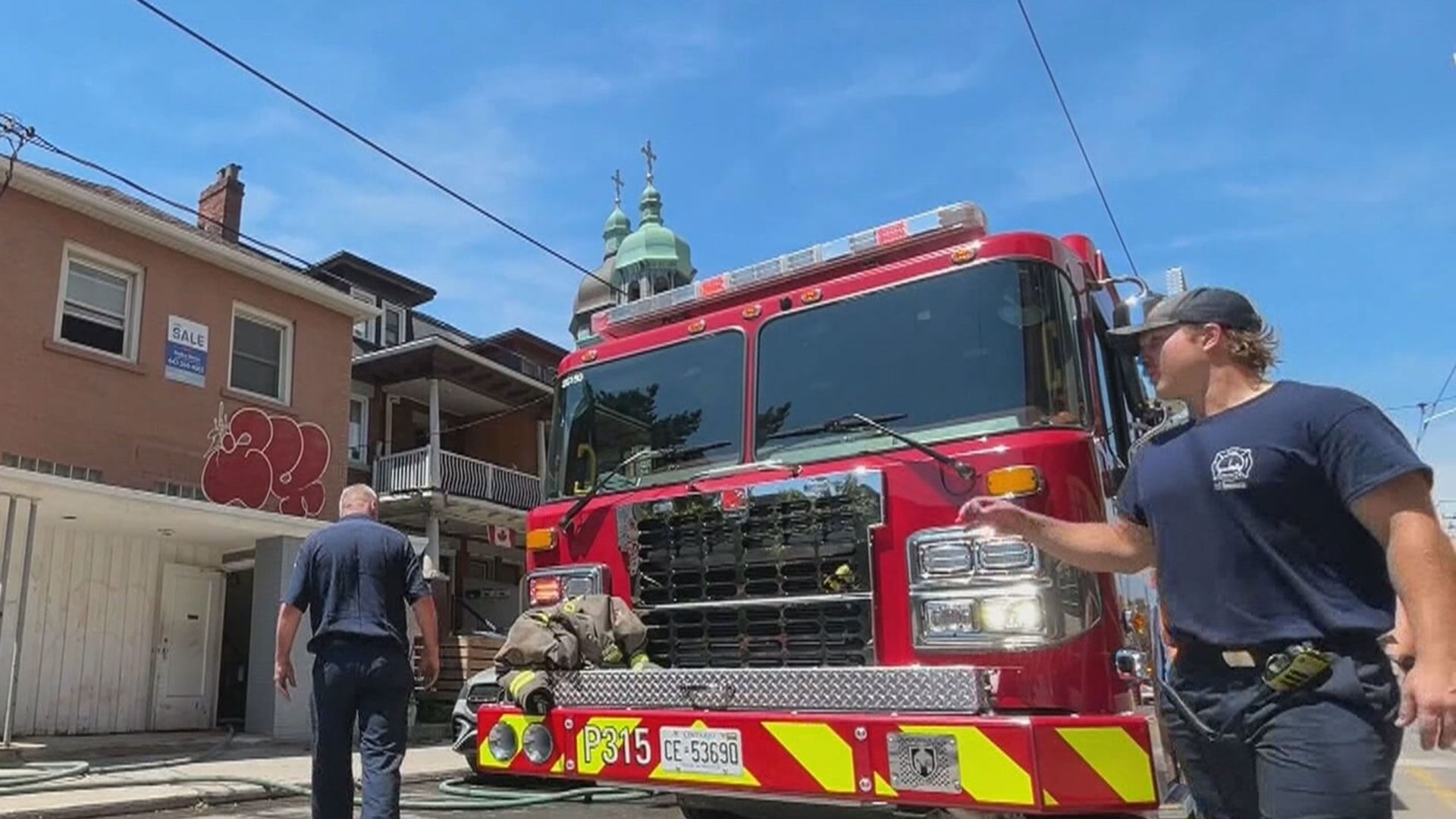 Downtown house fire challenges crews amid sweltering heat